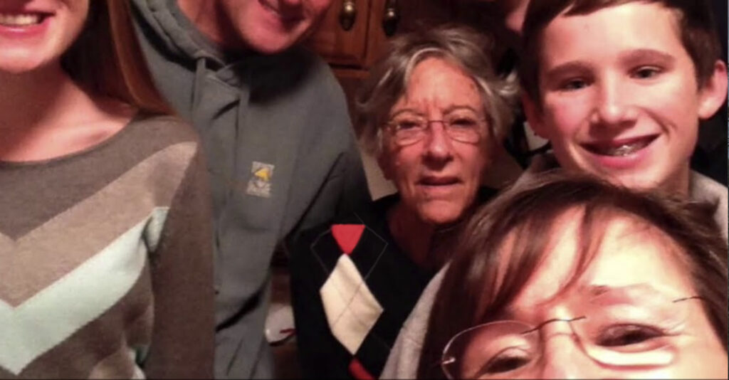 family of senior living resident posing for photo